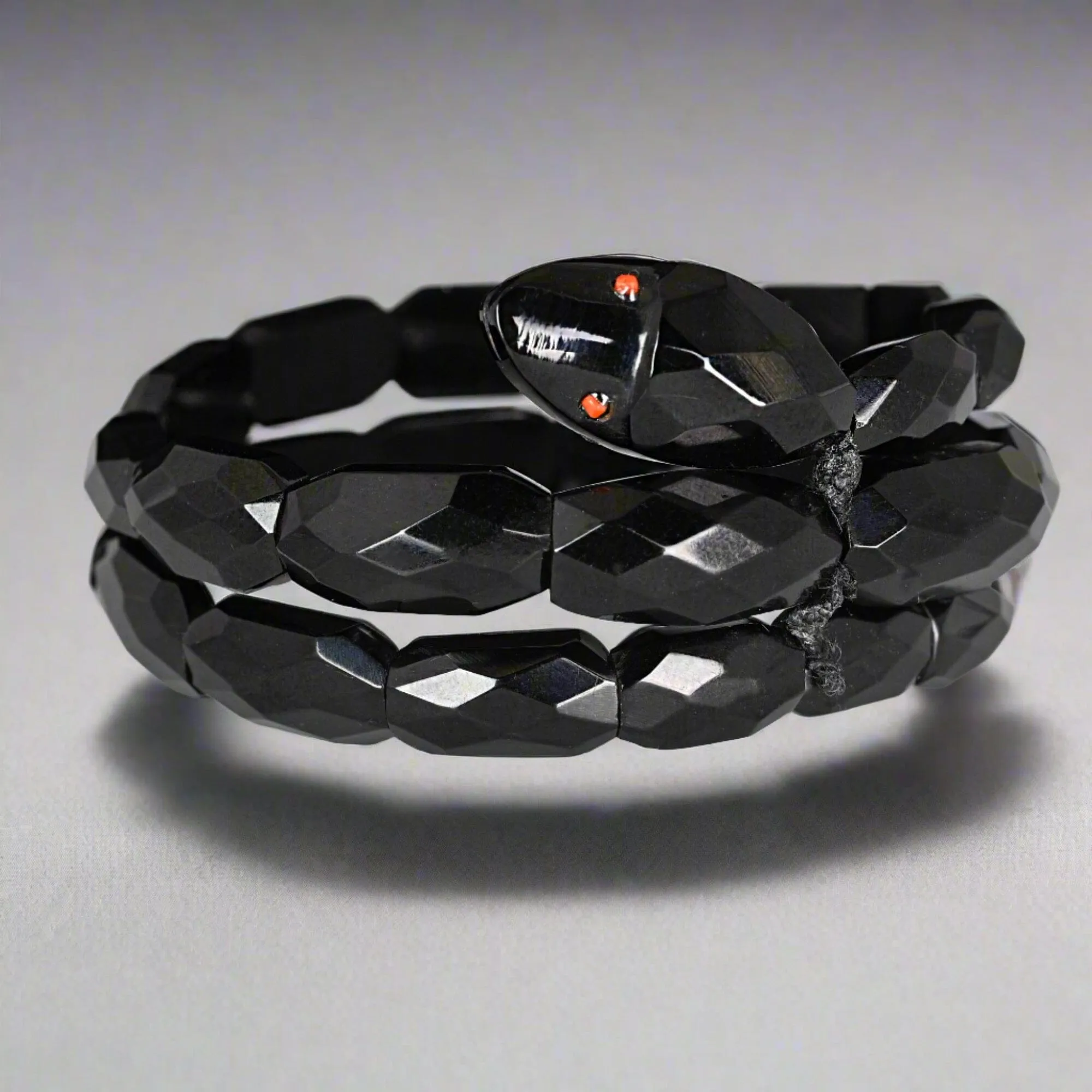Antique Victorian Coral Eyed Whitby Jet Snake Bracelet