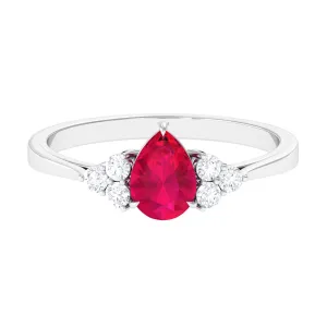 Claw Set Ruby Pear Solitaire Ring with Diamond Trio