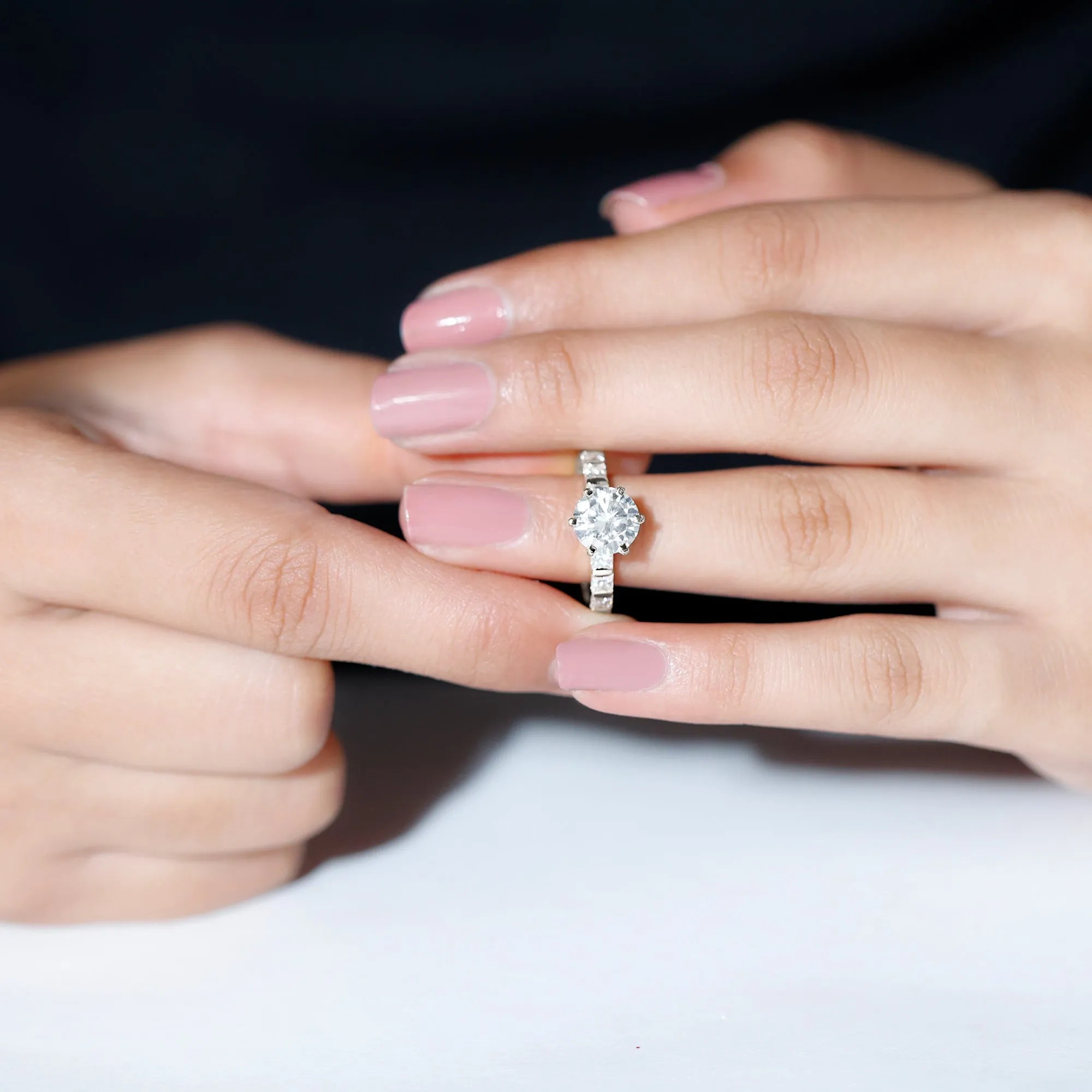 Round Moissanite Solitaire Engagement Ring with Princess Cut Side Stones