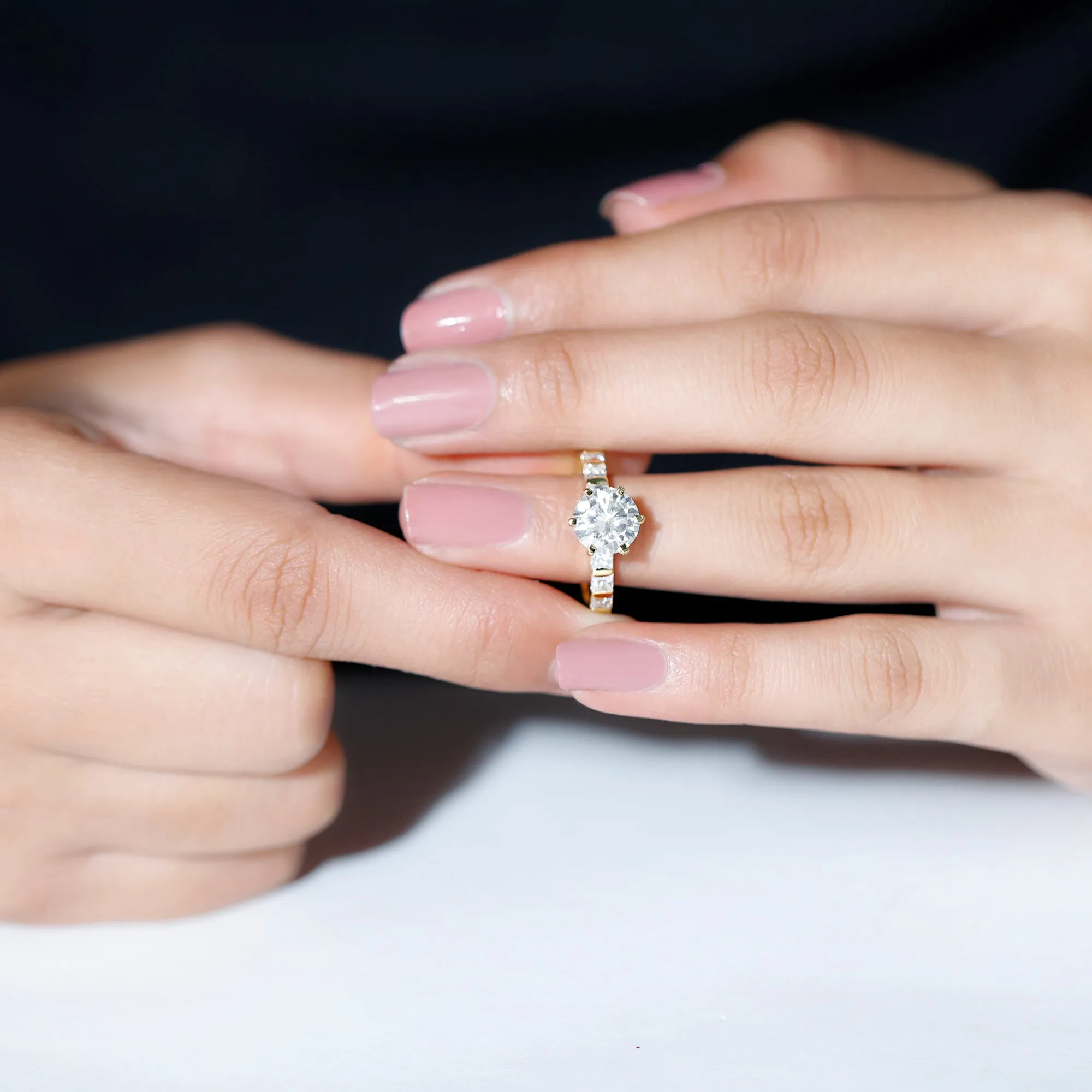 Round Moissanite Solitaire Engagement Ring with Princess Cut Side Stones