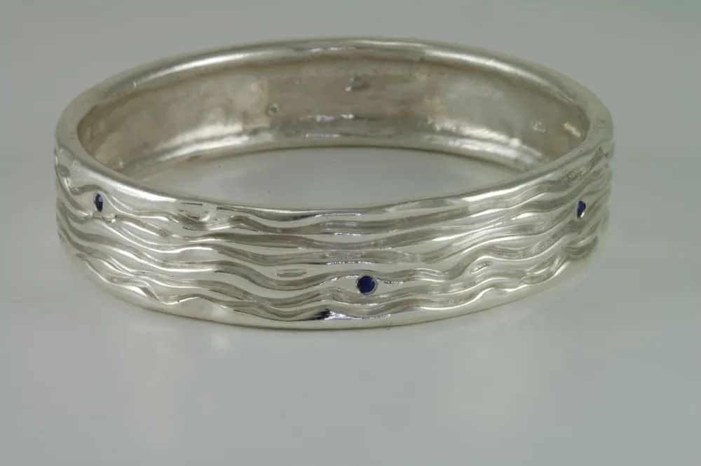 Sterling Silver Bangle Bracelet With Six Small Blue Sapphires
